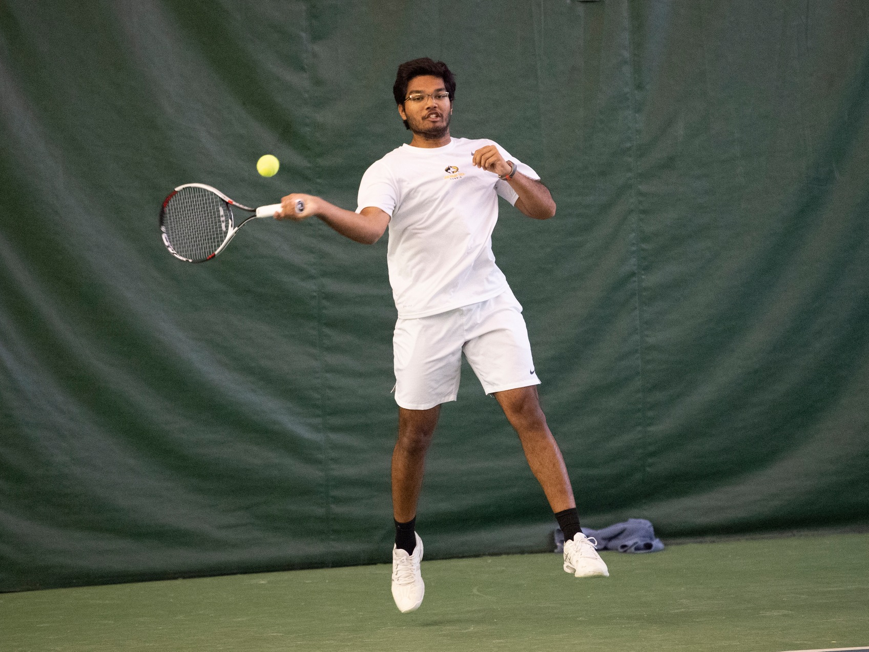 Siddhesh Mahadeshwar swings tennis racket
